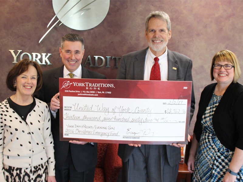 Pictured with Bob Woods, Executive Director for United Way of York County (second from right) are Traditions Bank representatives (left to right) Carolyn Schaefer, Managing Director of Specialized Banking; Gene Draganosky, President & CEO; and Melissa Moore, Personal Banking Delivery Specialist and coordinator of the donations.