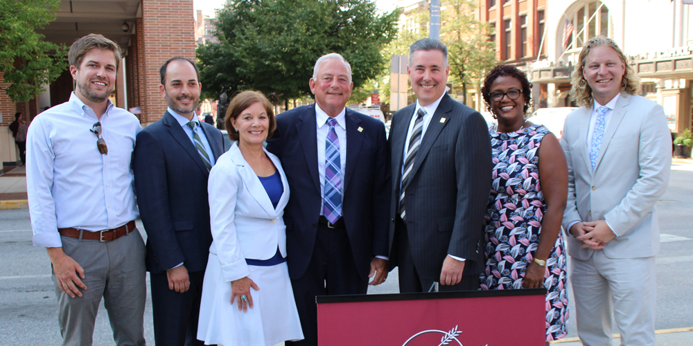 Left to Right: Dylan Bauer, Partner and Development Director, Royal Square Development and Construction (RSDC); Benjamin Chiaro, Brokerage Advisor, ROCK Commercial Real Estate; Susan Byrnes, York County President Commissioner; Mike Kochenour, Founder and Chairman of the Board, Traditions Bank; Gene Draganosky, President and CEO, Traditions Bank; Mayor Kim Bracey, York City; and Kevin Schreiber, President and CEO, York County Economic Alliance.
