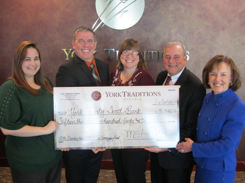 Pictured are (L to R) Amanda Shank and Jonathan Fisher from the York County Food Bank, along with Melissa Moore, Mike Kochenour and Carolyn Schaefer from Traditions Bank.