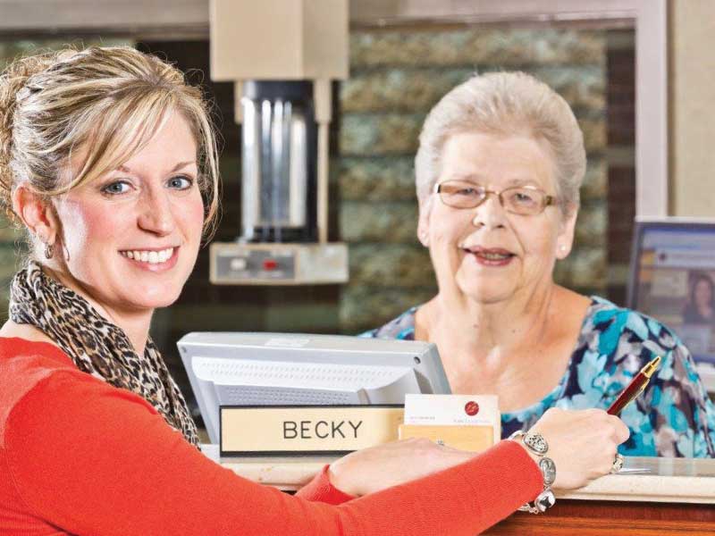 Pictured is one of our valued, long-time customers, Dr. Heather Lawrence of Tamarkin Eye Associates, with Becky Amspacher, Senior Client Care Specialist and one of our very first Associates who helped open Traditions Bank on October 28, 2002!