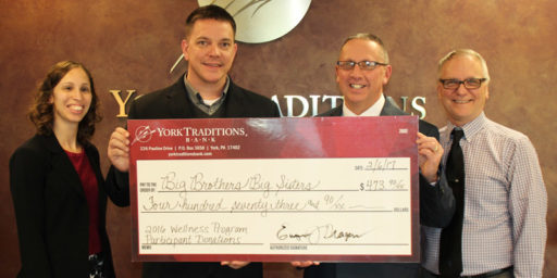 Left to Right: Wellness Committee Co-Chair Kristi Riley-Platt, Mortgage Services Operations Manager, presents a donation to Michael Smith, Executive Director of Big Brothers Big Sisters, along with Mike Huson, Managing Director Commercial Banking and BBBS Board Member, and Wellness Committee member Darryl Eberly, Loan Accounting Specialist.