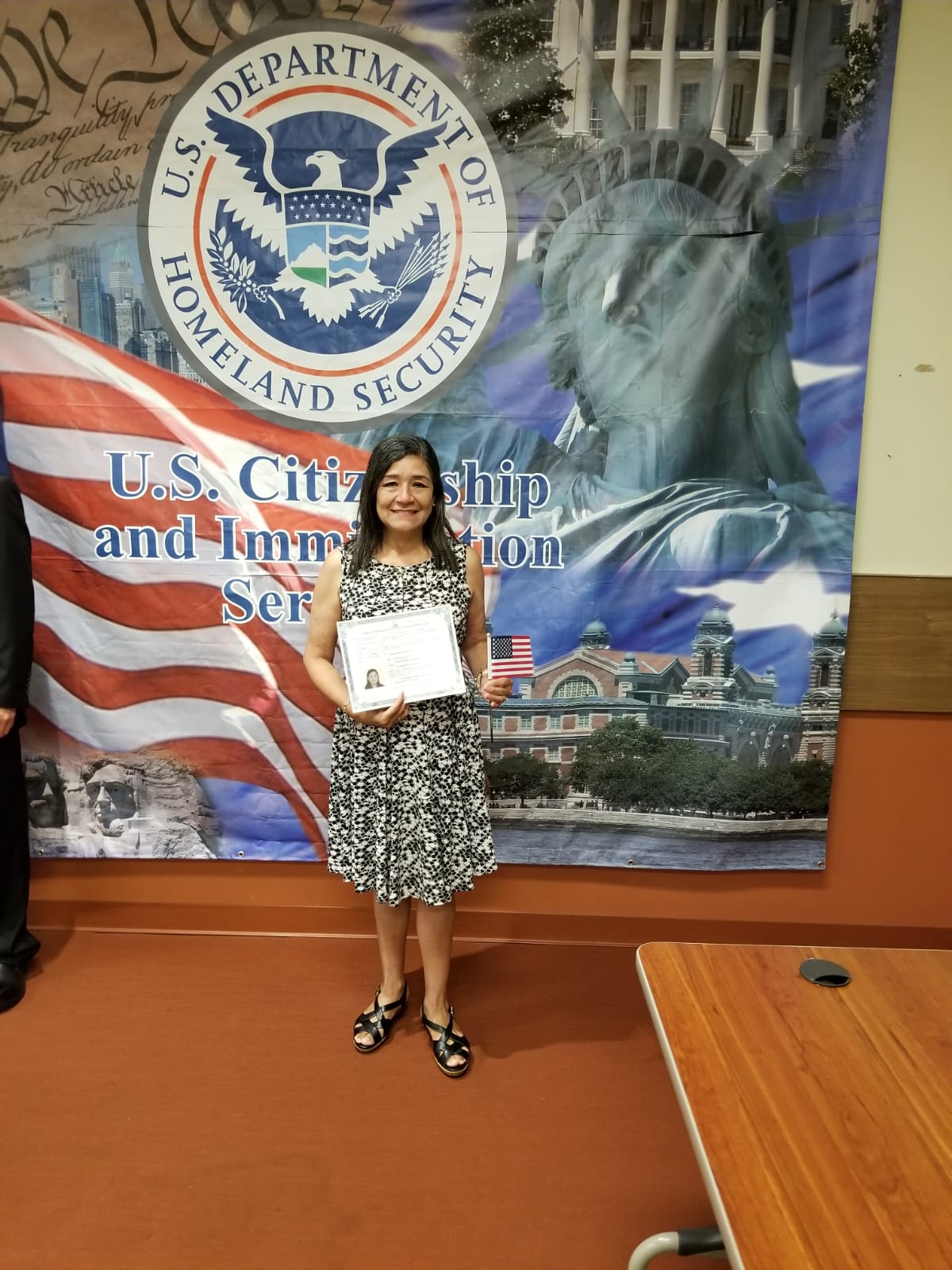 Photo of a woman at her US citizenship celebration