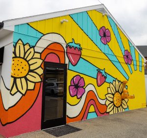 Colorful mural on the exterior of a custard shop
